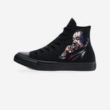 Voices of Freedom: MLK & Malcolm X Blackout Converse All-Star Sneakers — original artwork on a light-gray studio background.