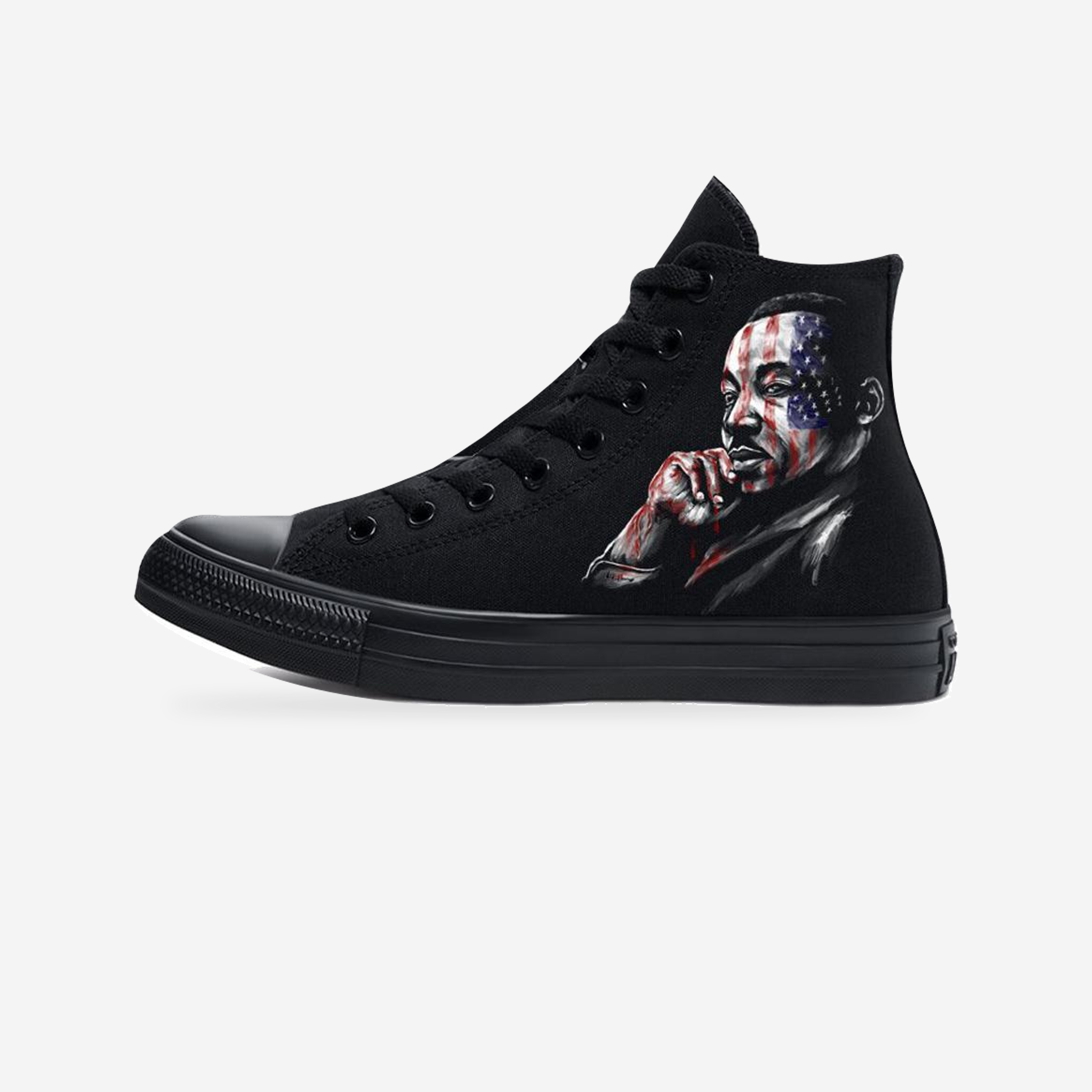 Voices of Freedom: MLK & Malcolm X Blackout Converse All-Star Sneakers — original artwork on a light-gray studio background.
