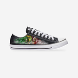Bob Marley Pure Joy custom Converse low-top sneaker, side view on a light gray background.